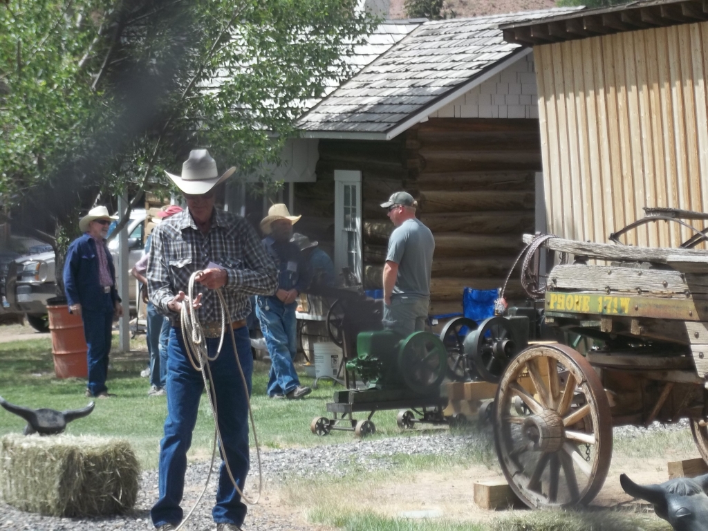 man with lasso old wagon